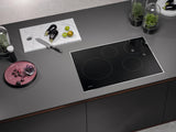 KM 7730 FR - 30-inch induction cooktop, operated with its own controls with 4 round cooking zones